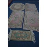 FIVE VARIOUS CHINESE RUGS, to include three pink rectangular rugs, etc