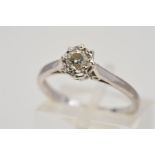 AN 18CT WHITE GOLD SINGLE STONE DIAMOND RING, designed as a brilliant cut diamond within an illusion