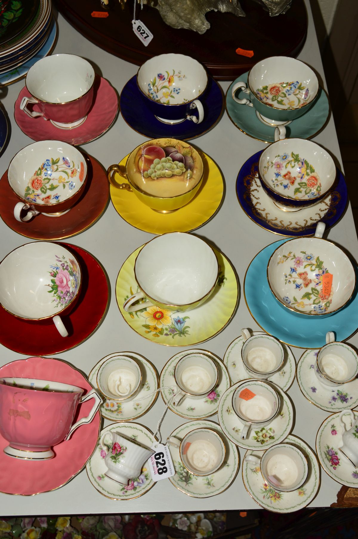 NINE AYNSLEY CUPS AND SAUCERS, ONE CROWN STAFFORDSHIRE, together with eight Queens miniature cups