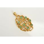 A 1970'S GOLD EMERALD PENDANT, of openwork textured design claw set with eight circular emeralds,