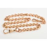 A 9CT GOLD DOUBLE ALBERT CHAIN, of curb link design with a lobster clasp to both terminals, no T-