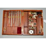 AN EARLY 20TH CENTURY BOXED MEDICAL KIT, containing various medical instruments within a hinged