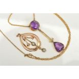 TWO EARLY 20TH CENTURY 9CT GOLD PENDANTS, the first designed as a circular amethyst within a