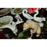 A LLADRO SEATED BROWN BEAR, No1205, height 11cm, together with four Lladro Ducks/Geese (one with