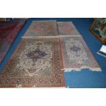 TWO MATCHING PINK KASHAN STYLE RUGS, 199cm x 141cm together with four similar smaller rugs and