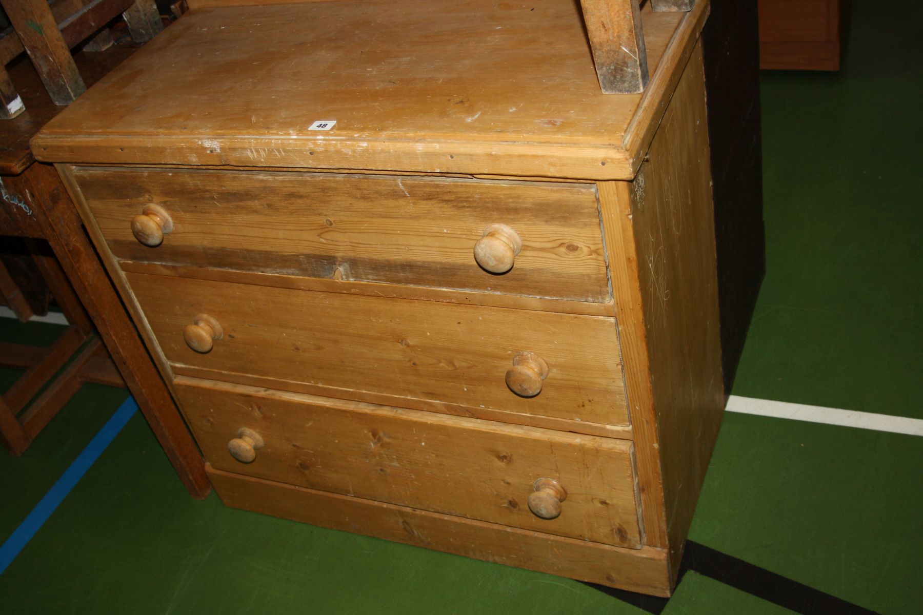 A VINTAGE PINE CHEST OF THREE LONG DRAWERS, with six beechwood turned handles 89x43x82cm (s.d)