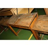 A VINTAGE DOUBLE SCHOOL DESK, with oak top, two lift up lids, two copper sliding ink well cover