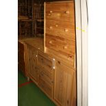 A MODERN PINE SIDEBOARD, with three drawers between two cupboard doors 156x46x88cm high and a pine