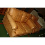 AN ANTIQUED FAWN LEATHER TWO PIECE SUITE, consisting of a two seater sofa (147cm wide) and an arm