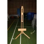 A MODERN BEECHWOOD ARTISTS ADJUSTABLE EASEL, height adjusted from 170cm to 240cm