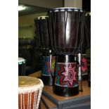 TWO PERCUSSION WORKSHOP JAMMER SERIES AFRICAN DRUMS with painted designs to the lower half and