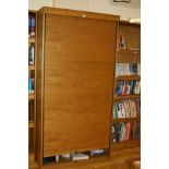 A MODERN OAK VENEERED ROLL FRONT CABINET, 100x55x200cm high (contents not included)