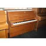 A KEMBLE UPRIGHT PIANO, with an oak case 130x106cm high (s.d)