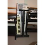 A YAMAHA DGX 200 PORTABLE GRAND, electronic piano 118cm wide, a MIDI START -2 keyboard 83cm wide and