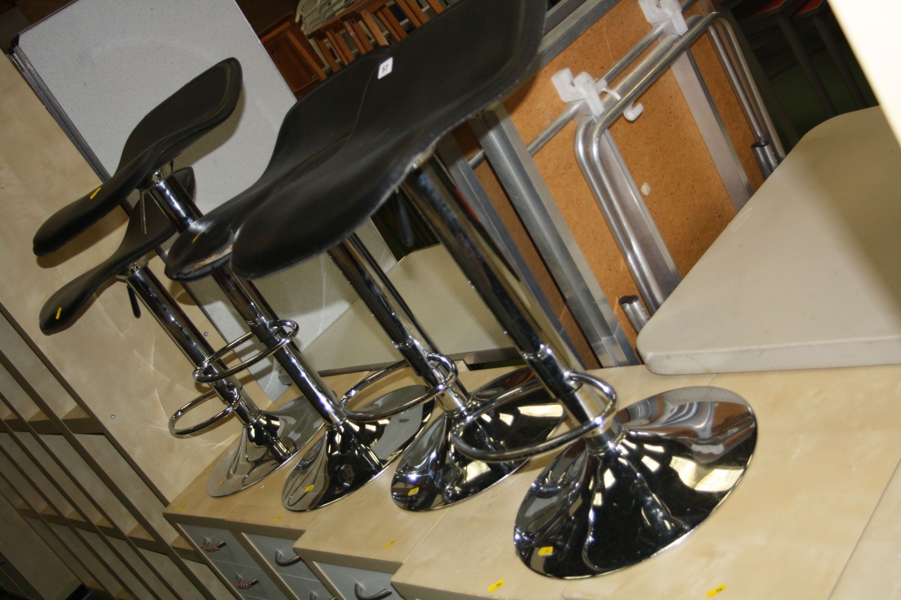 FOUR MODERN BACK AND CHROME BAR STOOLS, with height adjustment up to 80cm and foot supports (s.d)