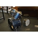 A PEAVEY INTERNATIONAL SERIES FIVE PIECE DRUM KIT, in metallic mid blue finish including a 22''x14''