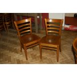 A SET OF EIGHT MODERN STAINED BEECH DINING CHAIRS, with shaped laminated seats