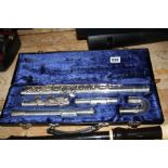 A CASED TREVOR J. JAMES SILVERED T.J 10X FLUTE