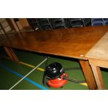 AN EARLY 20TH CENTURY OAK REFECTORY TABLE, standing on 3'' block legs 295x84x72cm high (s.d)