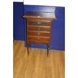 AN ART NOUVEAU MAHOGANY MUSIC CABINET, with four drawers (adapted to be fixed front) holding heart