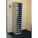 A QMP TALL NARROR LOCKER UNIT, with fifteen hinged doors with locks but no keys, 38x45x180cm high