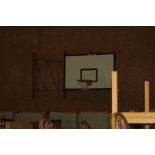 TWO BASKETBALL BACKBORDS AND RING WALL MOUNTED, (to be removed by buyer adhering to Health and