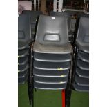 TWELVE GREY PLASTIC STACKING CHAIRS, with black tubular metal legs (s.d)