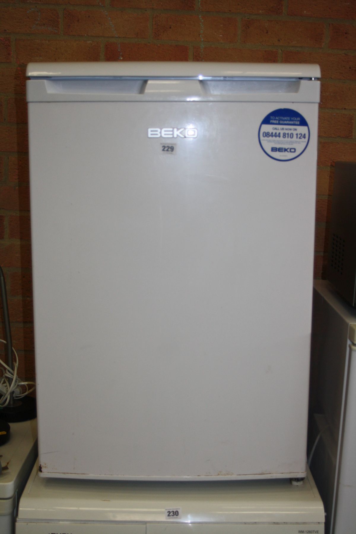 A BEKO UNDER COUNTER FRIDGE, 55cm wide