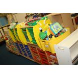 FOUR SCHOOLS UNITS, with plastic drawers, a bookcase containing pre school books and toys