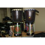 TWO PERCUSSION WORKSHOP JAMMER SERIES AFRICAN DRUMS with painted designs to the lower half and