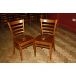 A SET OF EIGHT MODERN STAINED BEECH DINING CHAIRS, with shaped laminated seats