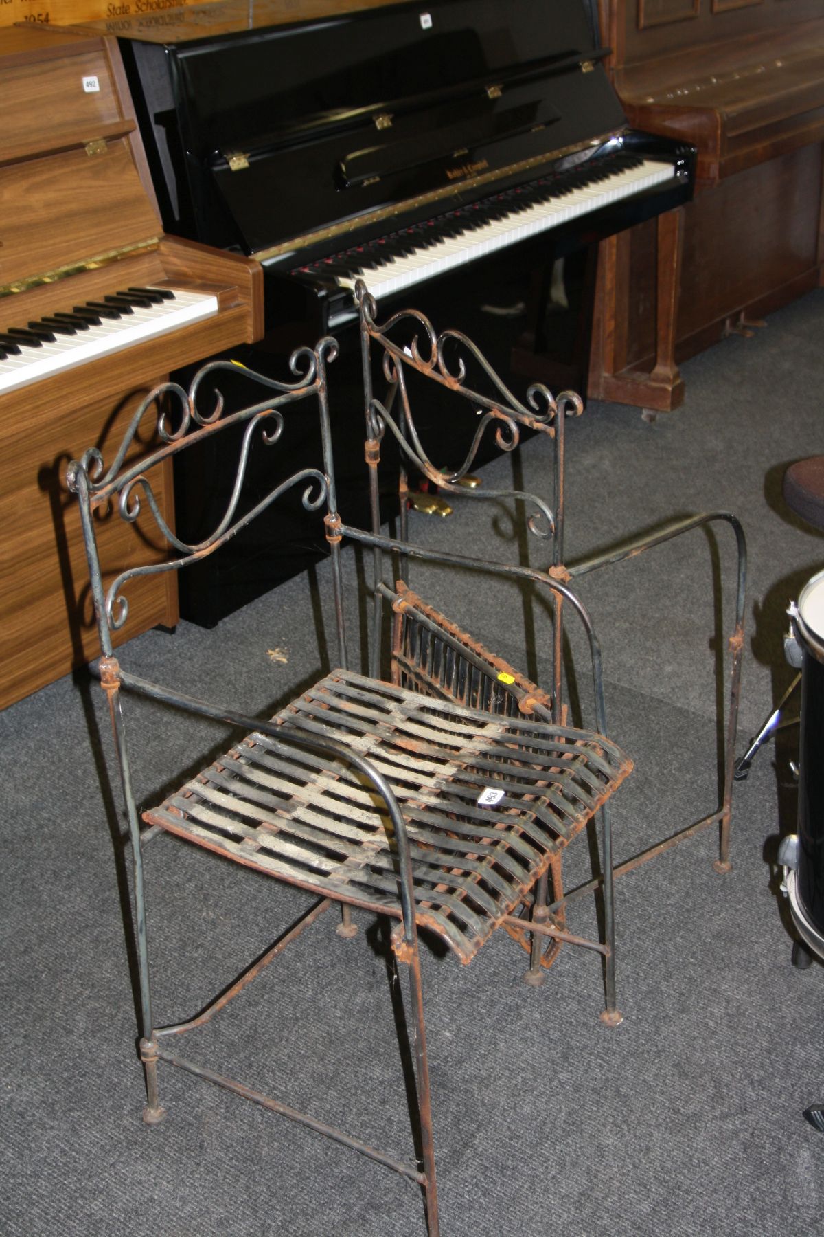 A PAIR OF MODERN WROUGHT IRON FOLDING GARDEN CHAIRS