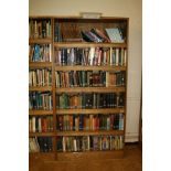 AN OAK VENEERED STANDING BOOKCASE, with five adjustable shelves, 101x35x200cm high (s.d) (content