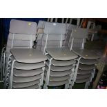 THIRTY FOUR GREY STACKING CHAIRS, with plastic seat and back over a tubular metal frame (s.d)