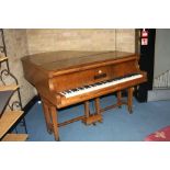 A C. KEMMLER & CO OF OSNABRUCK BABY GRAND PIANO, in a walnut case with a pine stool, 141cm wide