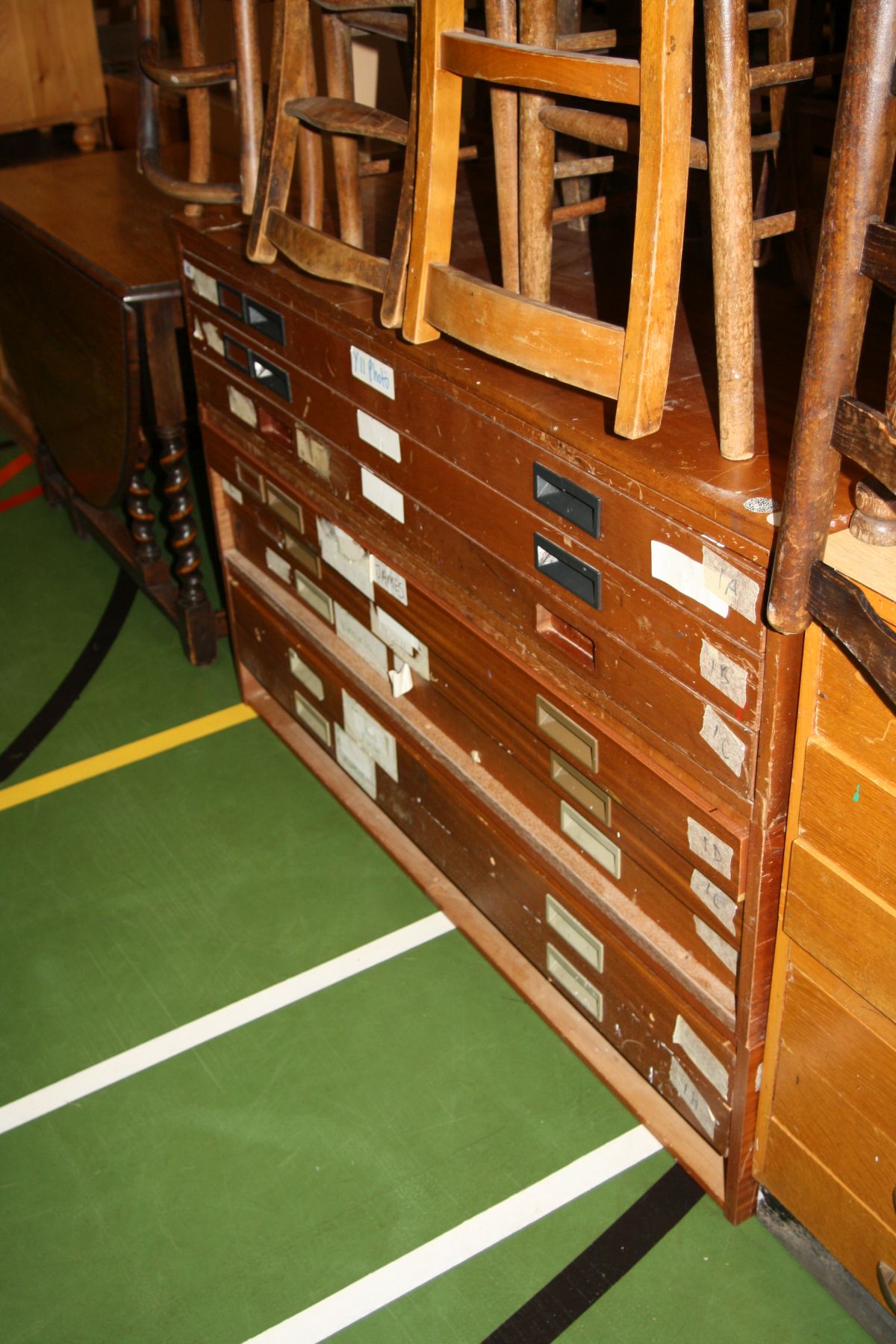 A MID CENTURY PLAN CHEST WITH EIGHT DRAWERS, (one missing), split into three down its height with