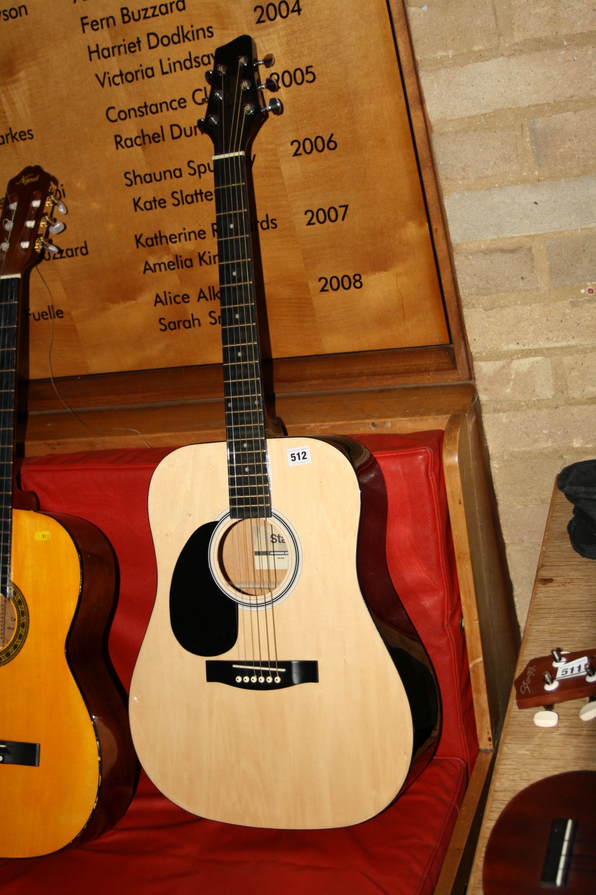 A STAGG SW201LH-N, left handed dreadnought acoustic guitar in natural finish