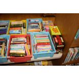FOUR TRAYS CONTAINING CHILDRENS BOOKS AND NOVELS