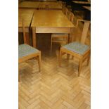 A SET OF SIX OAK DINING CHAIRS WITH UPHOLSTERED SEATS AND AN OAK LIBRARY TABLE, with solid oak