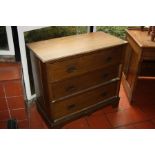 AN EDWARDIAN OAK CHEST OF THREE LONG DRAWERS, with brass drop handles 92x46x82cm high (s.d.)