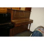 AN UNNAMED UPRIGHT PIANO, in mahogany case