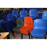 ELEVEN PILES OF PLASTIC AND METAL STACKING CHAIRS, varying designs and colours, approximately
