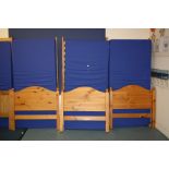 THREE PINE SINGLE BED FRAMES AND THREE WATERPROOF MATTRESS, 98cm wide