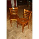 A SET OF TEN MODERN STAINED BEECH DINING CHAIRS, with shaped laminated seats