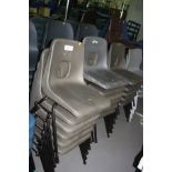 TWENTY SIX STACKING CLASSROOM CHAIRS, with moulded grey plastic seats over a tubular metal frame