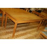 AN OAK LIBRARY TABLE, with solid oak legs and a veneered top, 183x86x76cm (s.d)