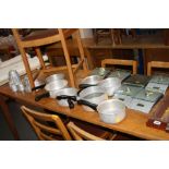 A SMALL COLLECTION OF KITCHENALIA, comprising jelly moulds, saucepans and kitchen scales