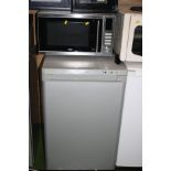 A SILVER ZANUSSI UNDER COUNTER FREEZER, 55cm wide and DeLonghi stainless steel microwave