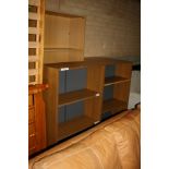 FOUR OAK EFFECT BOOKCASES, one standing 77x31x179cm high, the other three 75x32x120cm