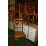 A SET OF SIX PINE ERCOL LADDER BACK DINING CHAIRS, with 1970's seat pads (no fire label to pads)